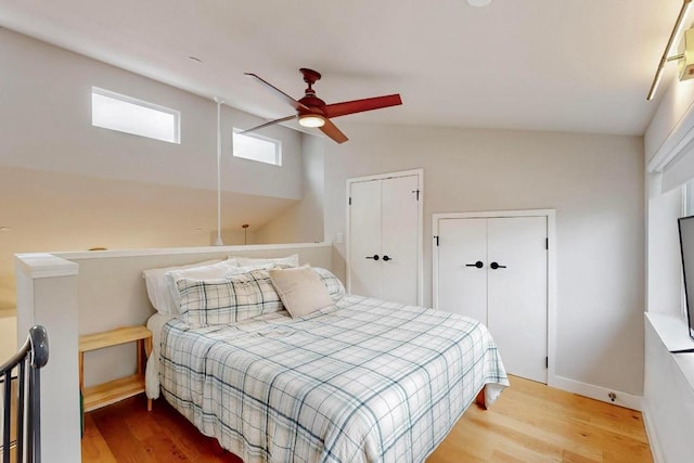 913 Duncan Ln Unit 103, Austin, TX 78705 - bedroom featuring wood finished floors, lofted ceiling, baseboards, and ceiling fan