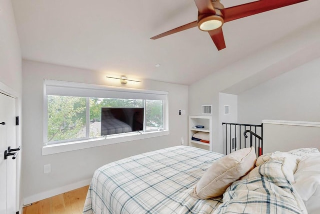 913 Duncan Ln Unit 103, Austin, TX 78705 - bedroom featuring multiple windows, wood finished floors, and baseboards