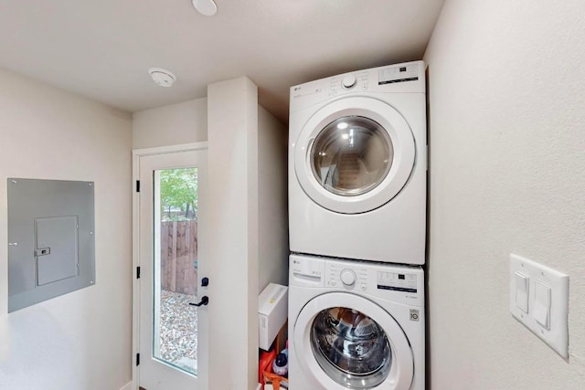 913 Duncan Ln Unit 103, Austin, TX 78705 - laundry area featuring electric panel and stacked washer and clothes dryer