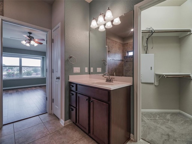 1501 Daylily Loop, Georgetown, TX 78626 - full bath featuring vanity, ceiling fan, baseboards, and a tile shower