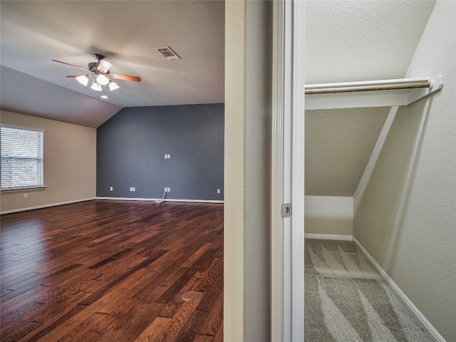 1501 Daylily Loop, Georgetown, TX 78626 - bonus room with a ceiling fan, vaulted ceiling, wood finished floors, a textured ceiling, and baseboards