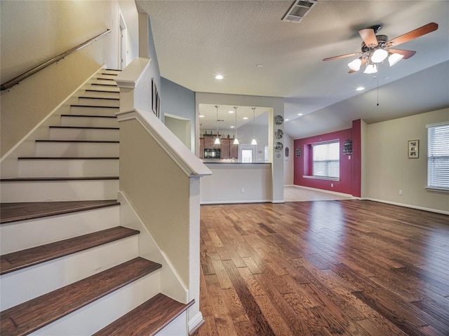 1501 Daylily Loop, Georgetown, TX 78626 - stairs featuring wood finished floors, ceiling fan, and baseboards