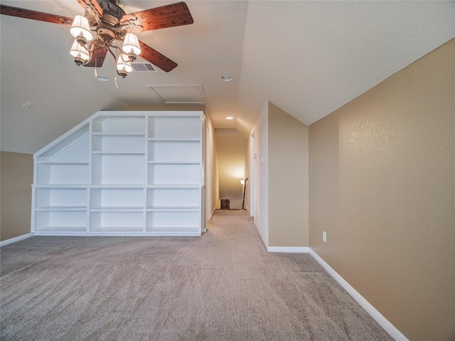1501 Daylily Loop, Georgetown, TX 78626 - additional living space featuring light colored carpet, built in features, vaulted ceiling, ceiling fan, and attic access
