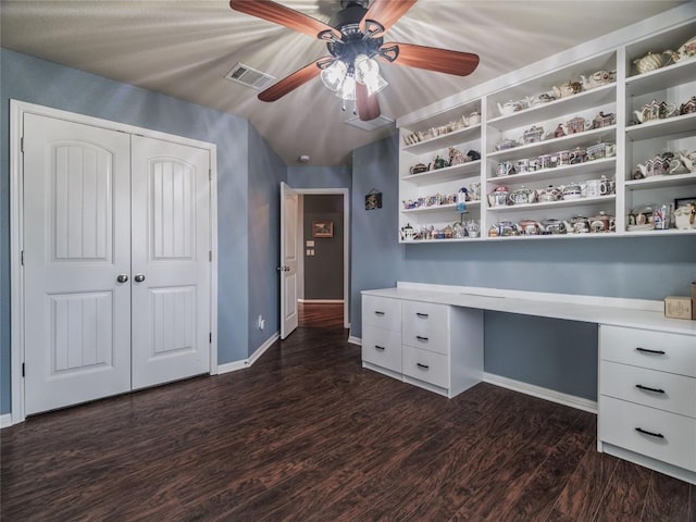1501 Daylily Loop, Georgetown, TX 78626 - unfurnished office with a ceiling fan, baseboards, built in study area, and dark wood-style floors