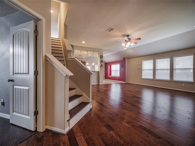 1501 Daylily Loop, Georgetown, TX 78626 - unfurnished living room with a ceiling fan, wood finished floors, baseboards, and stairway