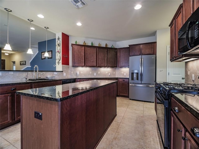 1501 Daylily Loop, Georgetown, TX 78626 - kitchen featuring black appliances, a sink, a kitchen island, tasteful backsplash, and dark stone counters