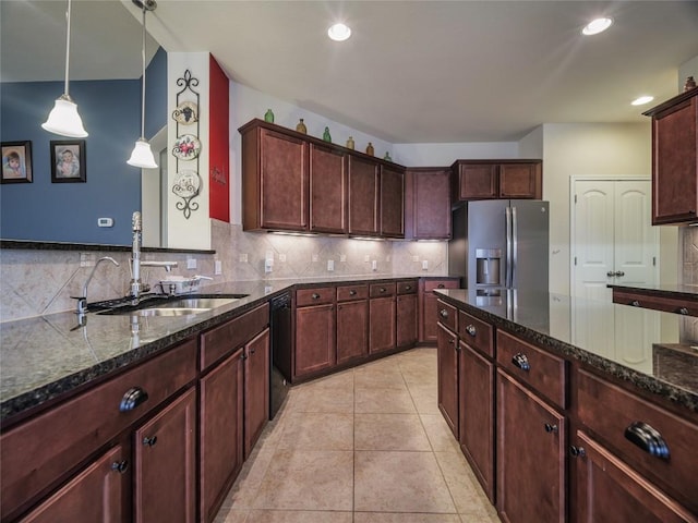 1501 Daylily Loop, Georgetown, TX 78626 - kitchen with stainless steel fridge with ice dispenser, a sink, dishwasher, dark stone countertops, and recessed lighting