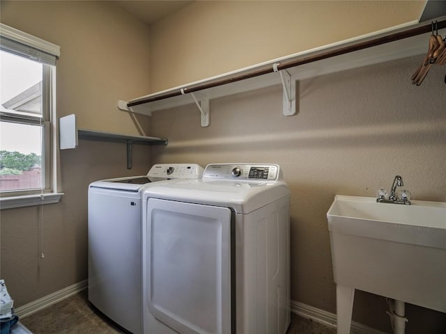 1501 Daylily Loop, Georgetown, TX 78626 - washroom featuring independent washer and dryer and baseboards