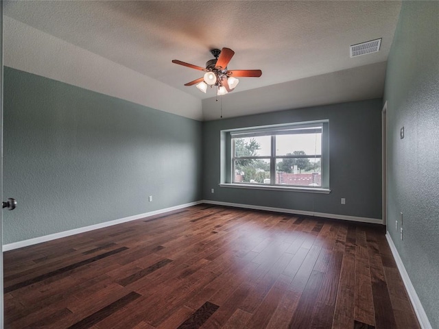 1501 Daylily Loop, Georgetown, TX 78626 - empty room with a textured wall, ceiling fan, dark wood-type flooring, and baseboards