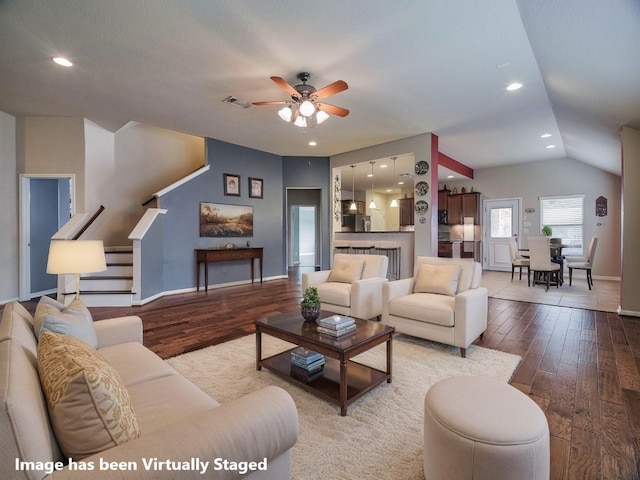 1501 Daylily Loop, Georgetown, TX 78626 - living area with wood-type flooring, ceiling fan, stairway, recessed lighting, and vaulted ceiling