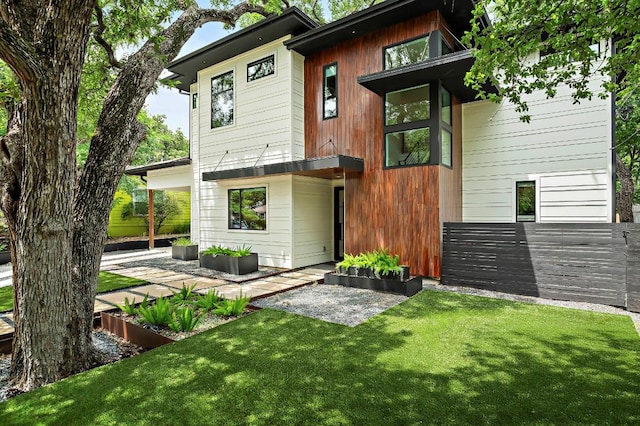 2312 Pruett St, Austin, TX 78703 - rear view of property with a lawn and a patio