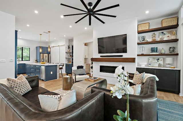 2312 Pruett St, Austin, TX 78703 - living area featuring light wood-style flooring, recessed lighting, a fireplace, and ceiling fan