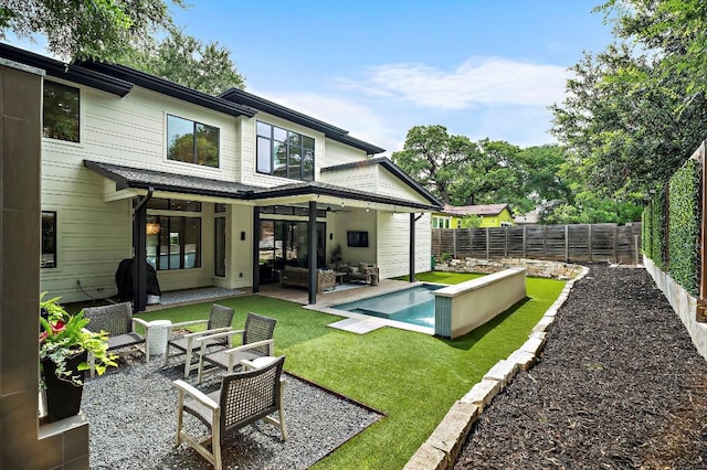 2312 Pruett St, Austin, TX 78703 - back of property with an outdoor living space, a ceiling fan, and a patio area