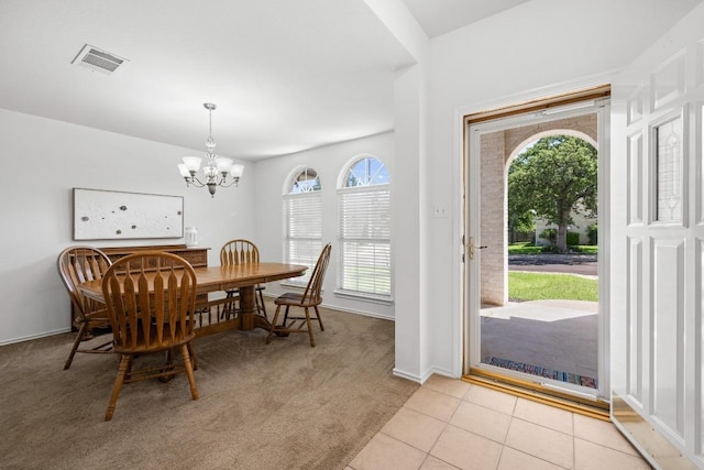 2803 Glenwood Trl, Cedar Park, TX 78613 - dining area featuring a chandelier, light carpet, light tile patterned floors, and baseboards