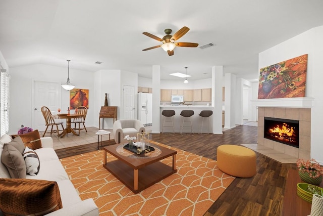 2803 Glenwood Trl, Cedar Park, TX 78613 - living area with wood finished floors, ceiling fan, a fireplace, and vaulted ceiling