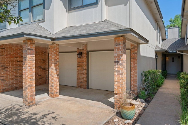 11814 Barrington Way, Austin, TX 78759 - view of exterior entry featuring a garage, brick siding, and concrete driveway