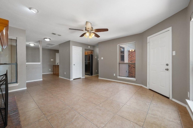 11814 Barrington Way, Austin, TX 78759 - unfurnished living room with ceiling fan, light tile patterned floors, and baseboards