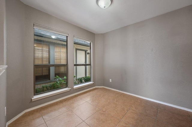 11814 Barrington Way, Austin, TX 78759 - empty room featuring light tile patterned floors and baseboards