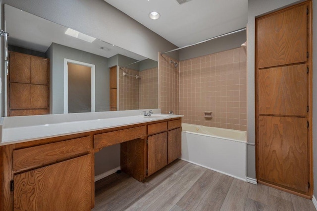 11814 Barrington Way, Austin, TX 78759 - full bathroom featuring wood finished floors, bathtub / shower combination, and vanity