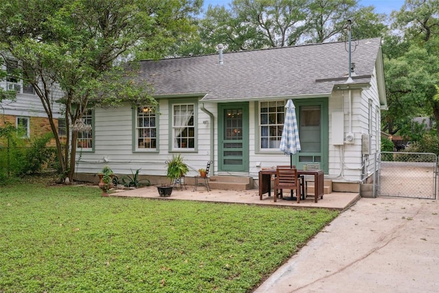 3003 Dancy St, Austin, TX 78722 - view of front of home with roof with shingles and a gate