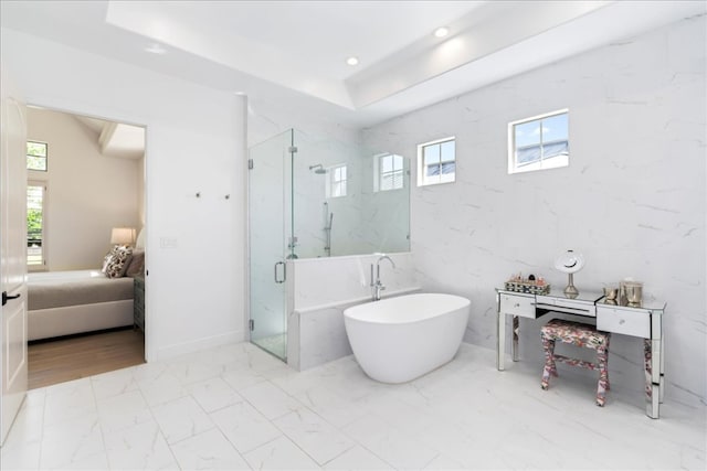 213 Black Wolf Run, Austin, TX 78738 - full bathroom featuring ensuite bathroom, marble finish floors, a marble finish shower, a soaking tub, and recessed lighting