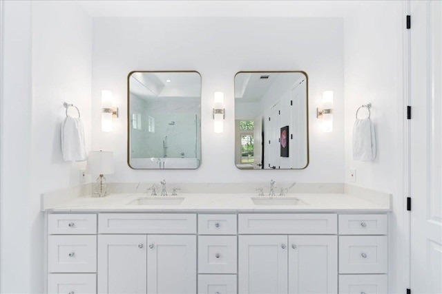 213 Black Wolf Run, Austin, TX 78738 - bathroom featuring a marble finish shower and double vanity