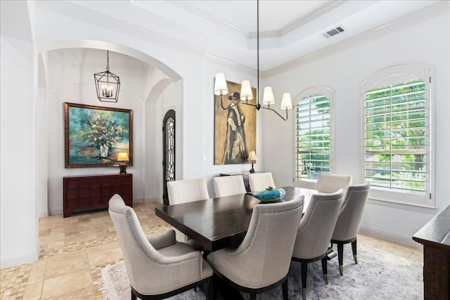 213 Black Wolf Run, Austin, TX 78738 - dining space featuring a chandelier, healthy amount of natural light, a raised ceiling, and ornamental molding