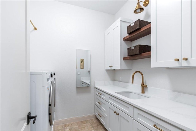 213 Black Wolf Run, Austin, TX 78738 - laundry room with cabinet space and washer and dryer