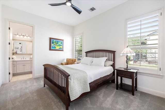 213 Black Wolf Run, Austin, TX 78738 - bedroom with light carpet, connected bathroom, and a ceiling fan
