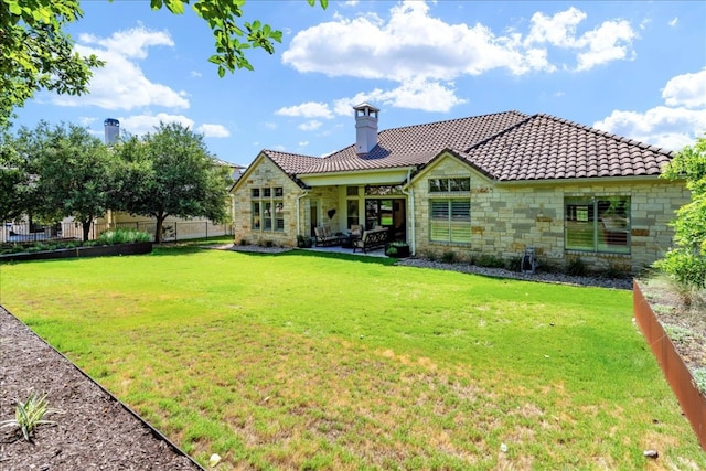 213 Black Wolf Run, Austin, TX 78738 - back of property featuring stone siding, a patio area, a tile roof, and a chimney
