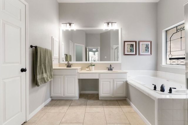 6307 Clairmont Dr, Austin, TX 78749 - bathroom with double vanity, a bath, and tile patterned flooring