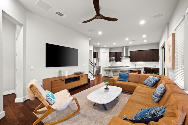 2807 Del Curto Rd Unit G, Austin, TX 78704 - living area featuring dark wood-type flooring, recessed lighting, a ceiling fan, baseboards, and stairs