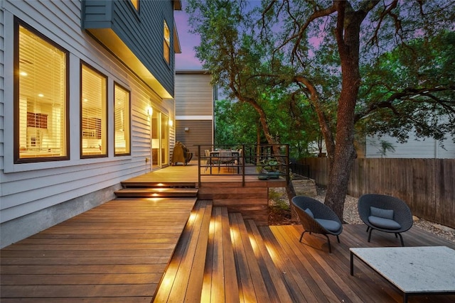 2807 Del Curto Rd Unit G, Austin, TX 78704 - deck at dusk with a fenced backyard