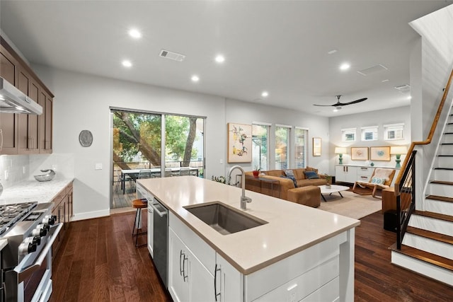 2807 Del Curto Rd Unit G, Austin, TX 78704 - kitchen featuring appliances with stainless steel finishes, ceiling fan, light countertops, healthy amount of natural light, and recessed lighting