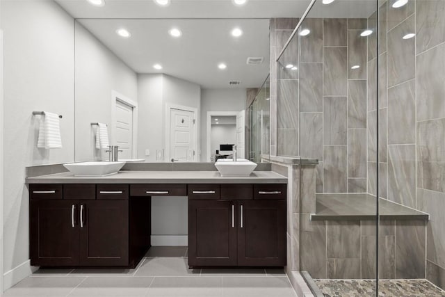 2807 Del Curto Rd Unit G, Austin, TX 78704 - bathroom featuring double vanity, a shower stall, tile patterned floors, and recessed lighting