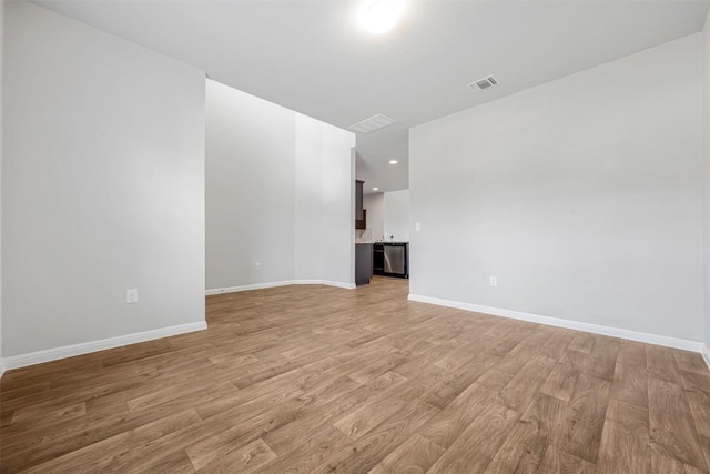 10820 Gonzales Ranger Pass, Austin, TX 78754 - unfurnished room featuring light wood finished floors, baseboards, and recessed lighting