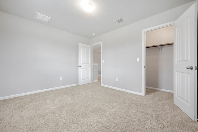 10820 Gonzales Ranger Pass, Austin, TX 78754 - unfurnished bedroom featuring carpet floors, baseboards, and a closet