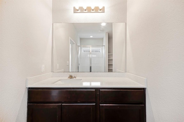 10820 Gonzales Ranger Pass, Austin, TX 78754 - bathroom featuring vanity and a textured wall