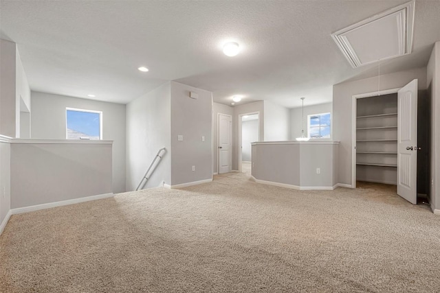 10820 Gonzales Ranger Pass, Austin, TX 78754 - spare room featuring attic access, carpet flooring, baseboards, and recessed lighting