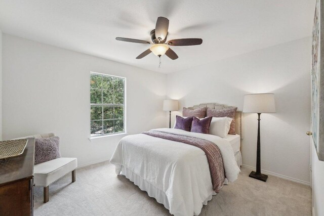 111 Hiver Cir, Kyle, TX 78640 - bedroom featuring light colored carpet and a ceiling fan