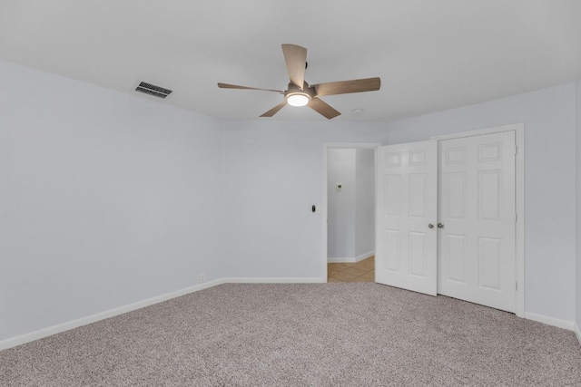 1908 Paradise Ridge Dr, Round Rock, TX 78665 - unfurnished bedroom with light colored carpet, baseboards, ceiling fan, and a closet