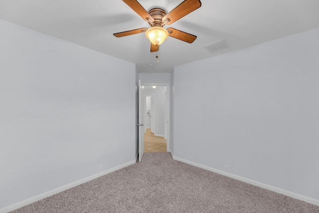 1908 Paradise Ridge Dr, Round Rock, TX 78665 - spare room with light colored carpet, baseboards, and ceiling fan