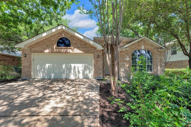 1908 Paradise Ridge Dr, Round Rock, TX 78665 - view of front of property with brick siding, concrete driveway, and an attached garage
