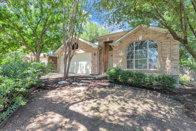 1908 Paradise Ridge Dr, Round Rock, TX 78665 - view of front of property featuring brick siding, an attached garage, and driveway
