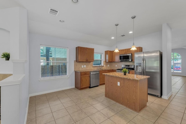 1908 Paradise Ridge Dr, Round Rock, TX 78665 - kitchen with appliances with stainless steel finishes, a sink, light tile patterned floors, tasteful backsplash, and recessed lighting