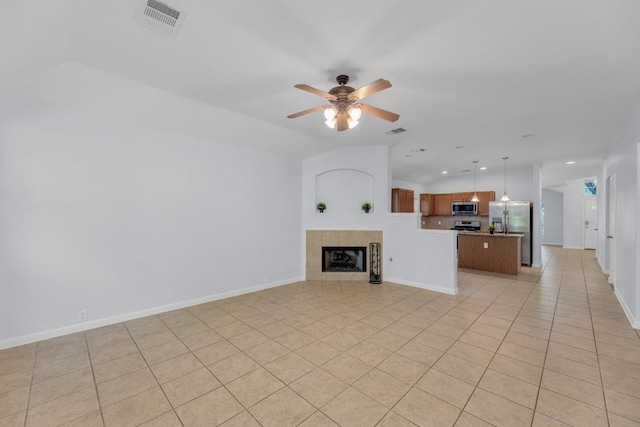 1908 Paradise Ridge Dr, Round Rock, TX 78665 - unfurnished living room featuring a ceiling fan, light tile patterned flooring, recessed lighting, baseboards, and a tiled fireplace
