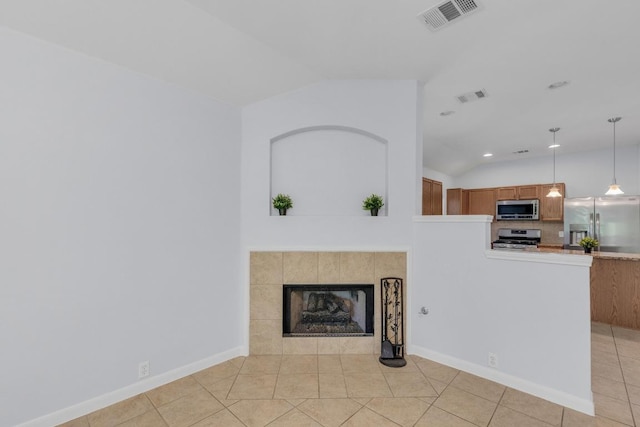 1908 Paradise Ridge Dr, Round Rock, TX 78665 - unfurnished living room with vaulted ceiling, light tile patterned floors, a fireplace, recessed lighting, and baseboards