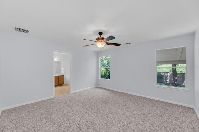 1908 Paradise Ridge Dr, Round Rock, TX 78665 - unfurnished room with healthy amount of natural light, light carpet, a ceiling fan, and baseboards