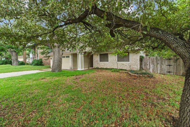 11708 Barrington Way, Austin, TX 78759 - view of property hidden behind natural elements with a garage, driveway, and stone siding