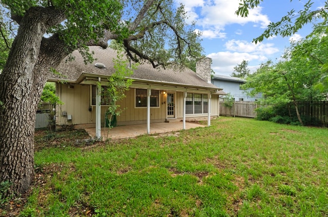 11708 Barrington Way, Austin, TX 78759 - back of property featuring a patio, a chimney, board and batten siding, and roof with shingles